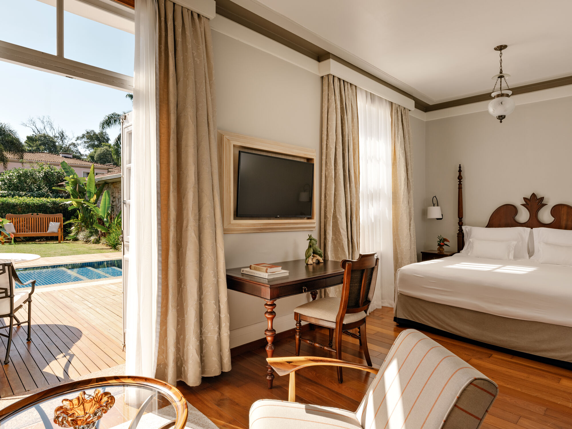 Pool Suite bedroom opening onto private pool at Belmond